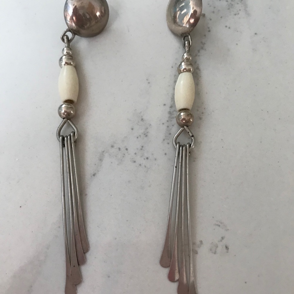 Sterling silver dangling earrings. 4” long. Pierce